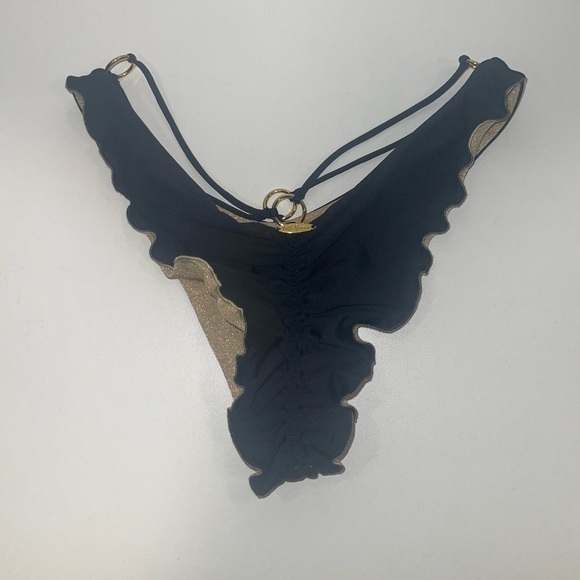 Luli Fama Strappy Loop Brazilian Bikini Bottom
Black Gold Ring Bikini Bottom Sm - Picture 6 of 7